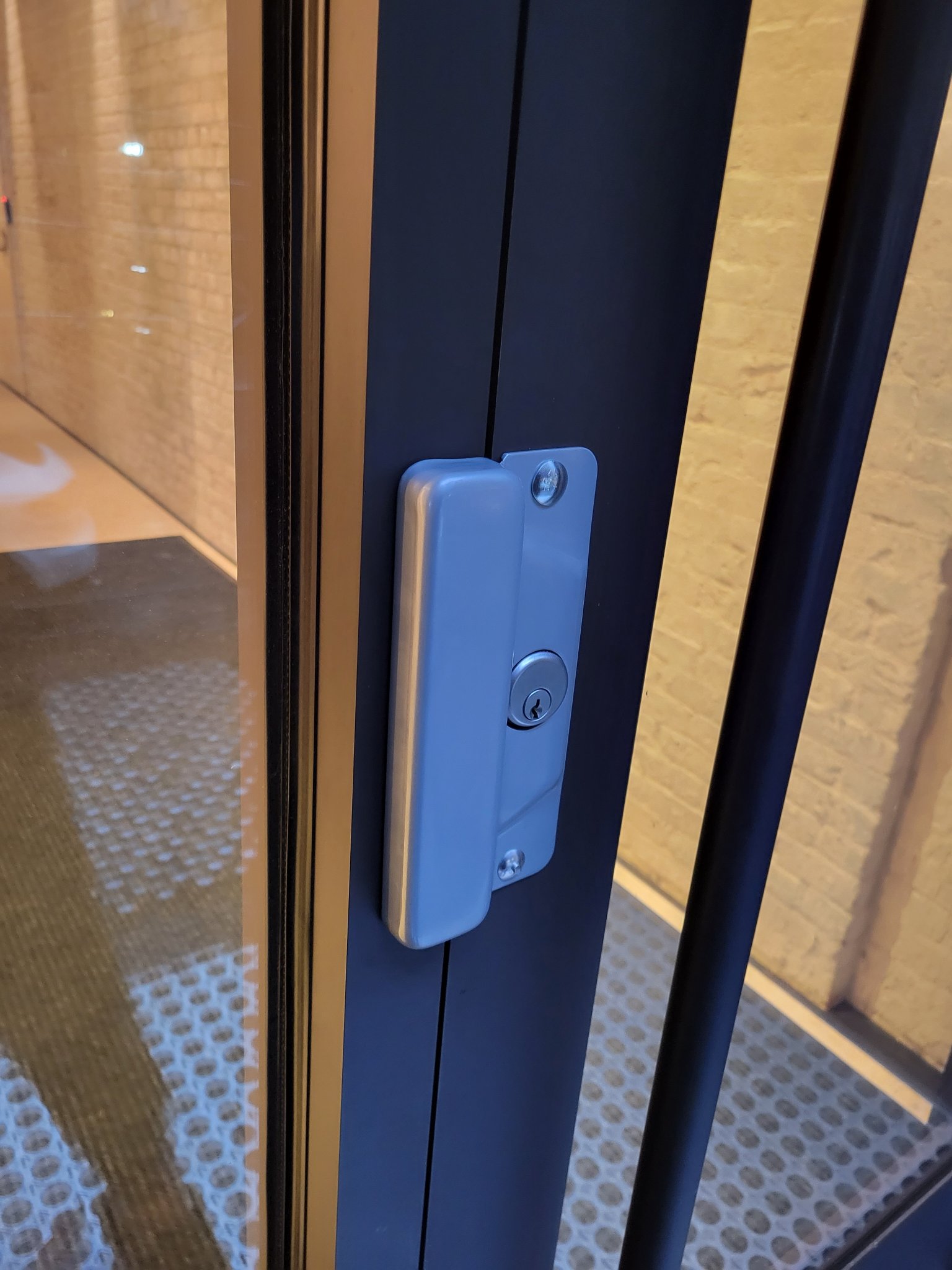 Brass entry hardware serviced on a classic Chelsea door.