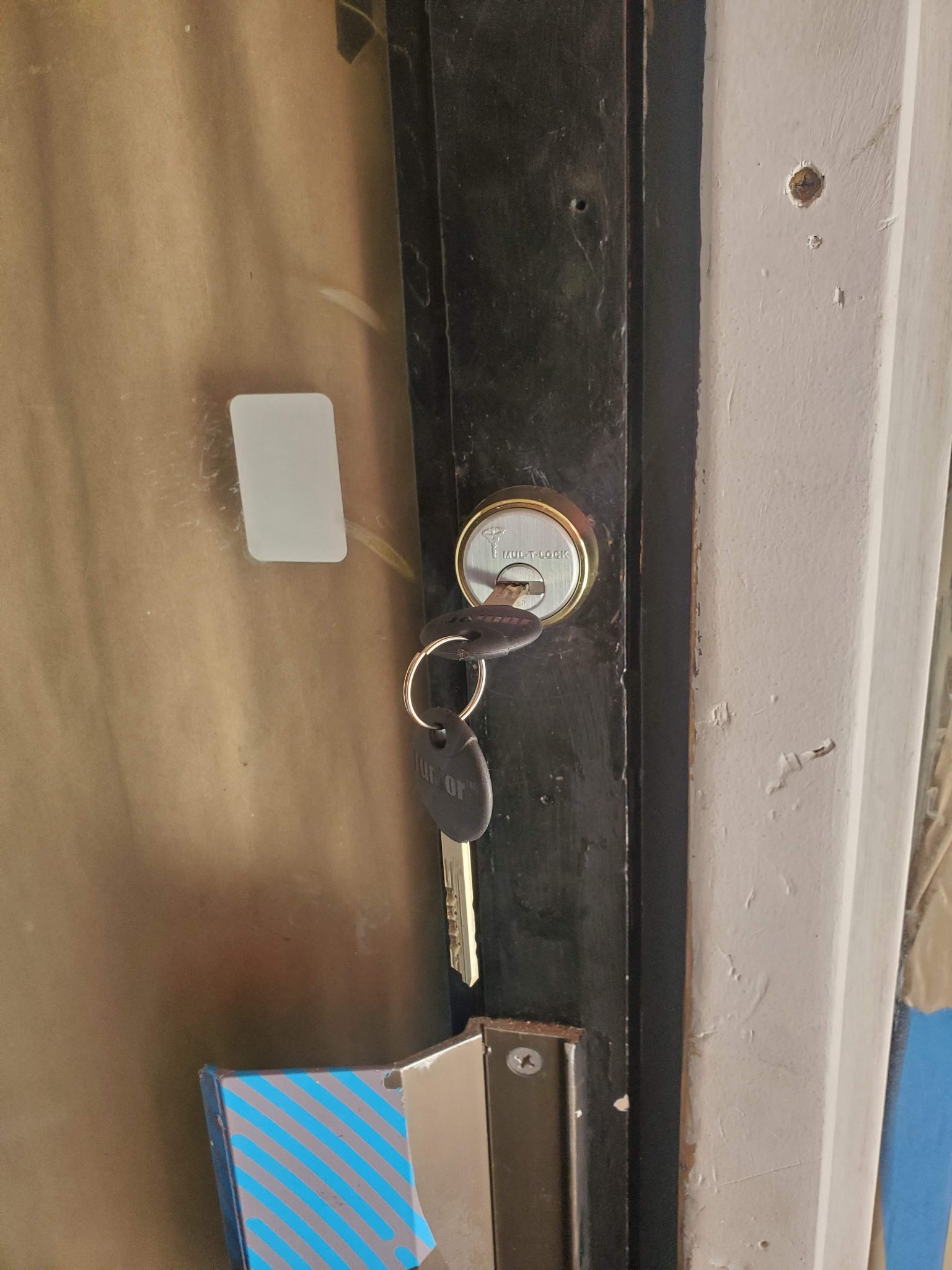 Modern deadbolt installation with reinforced strike plate.